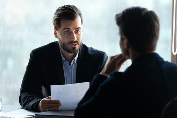 Representative explaining to a consumer about his account