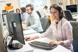 Group of representatives answering calls in a office