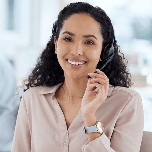 Young smiling females representative working in attending calls