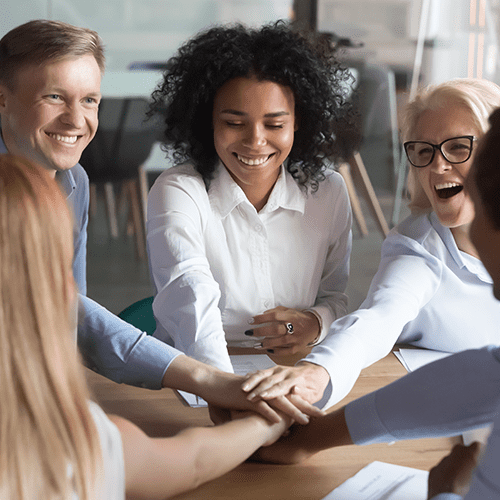 Team building concept, people placing hands one above another